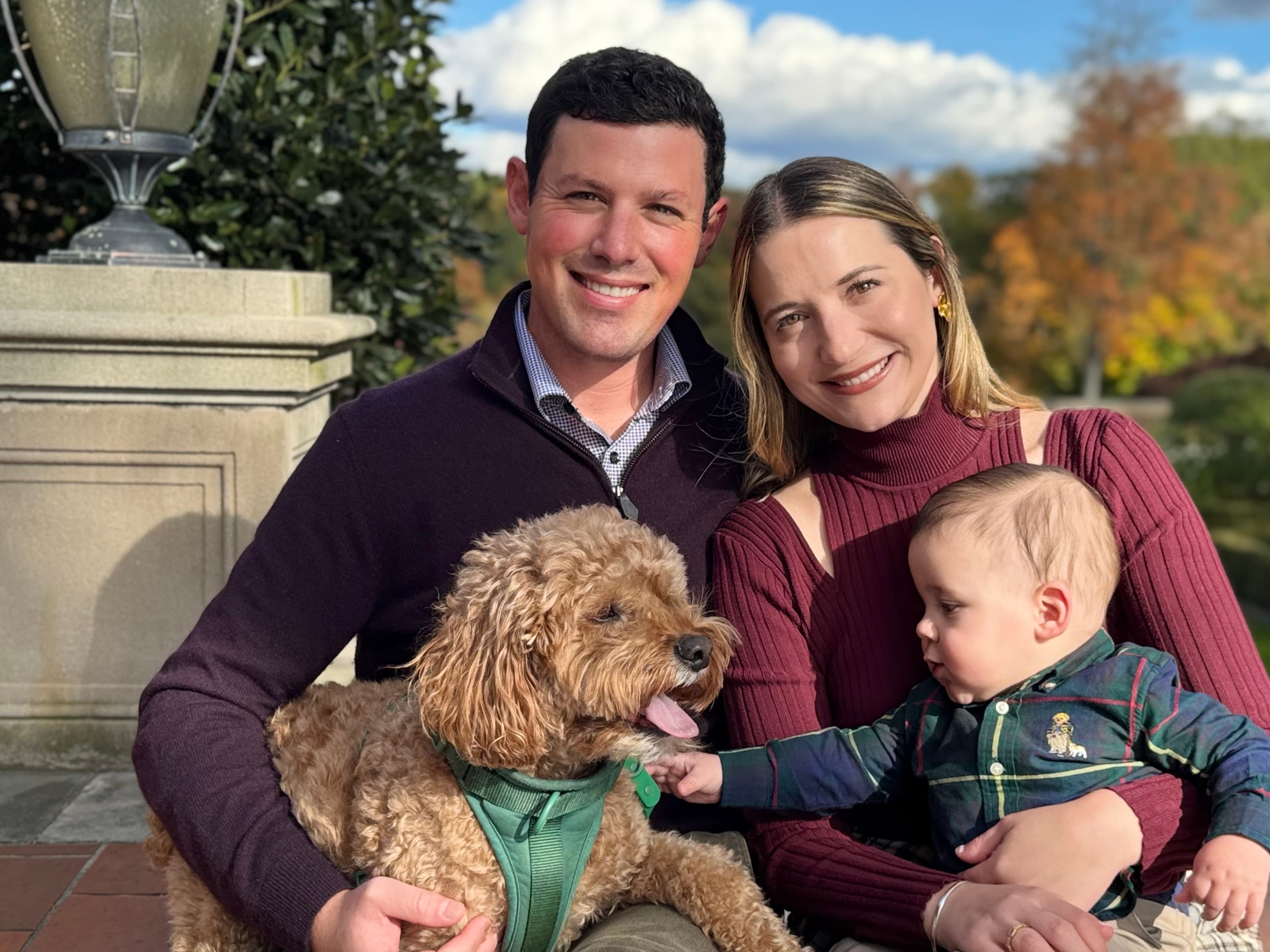 Zach with his family and dog outdoors